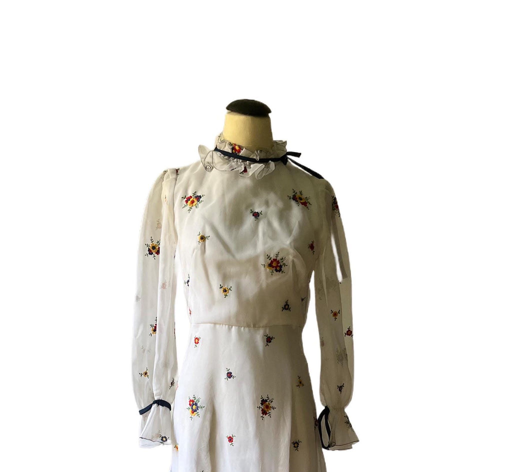 1970 white and flowered long train dress