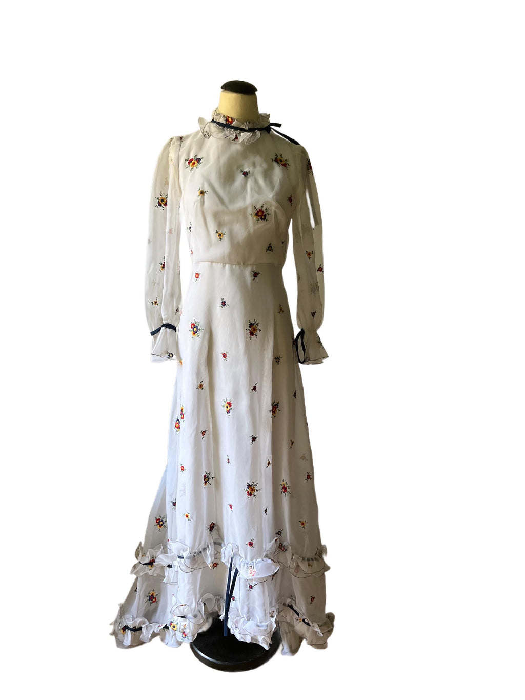 1970 white and flowered long train dress