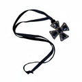 Retro 80s necklace with rhinestone cross charm – metal and vintage design